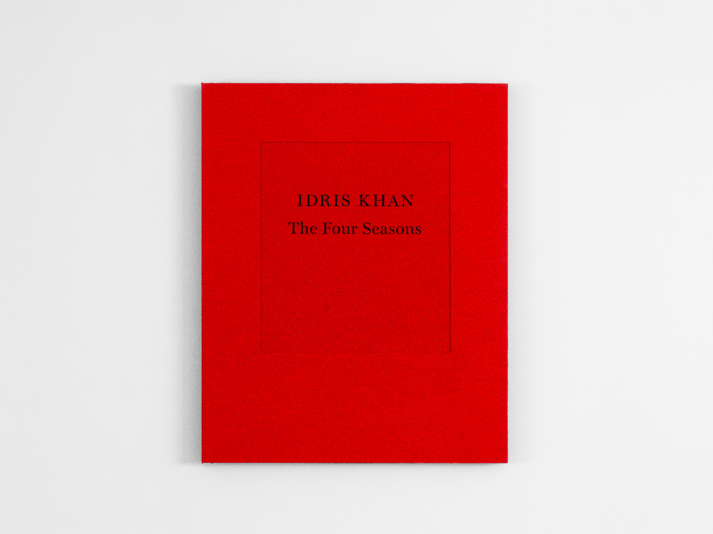The Four Seasons by Idris Khan — a red cloth portfolio case embossed with the artist's name and title, on a white ground.