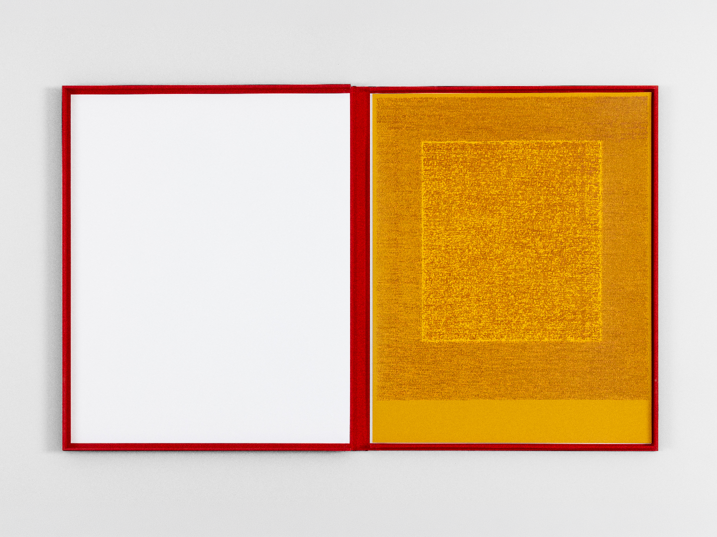 The Four Seasons portfolio open — a golden layered-score print in a red frame beside a blank left page.