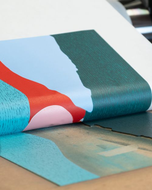 Afterglow woodcut on the press, its blue, red and green colour-fields printed on torn-edge Kozo paper.