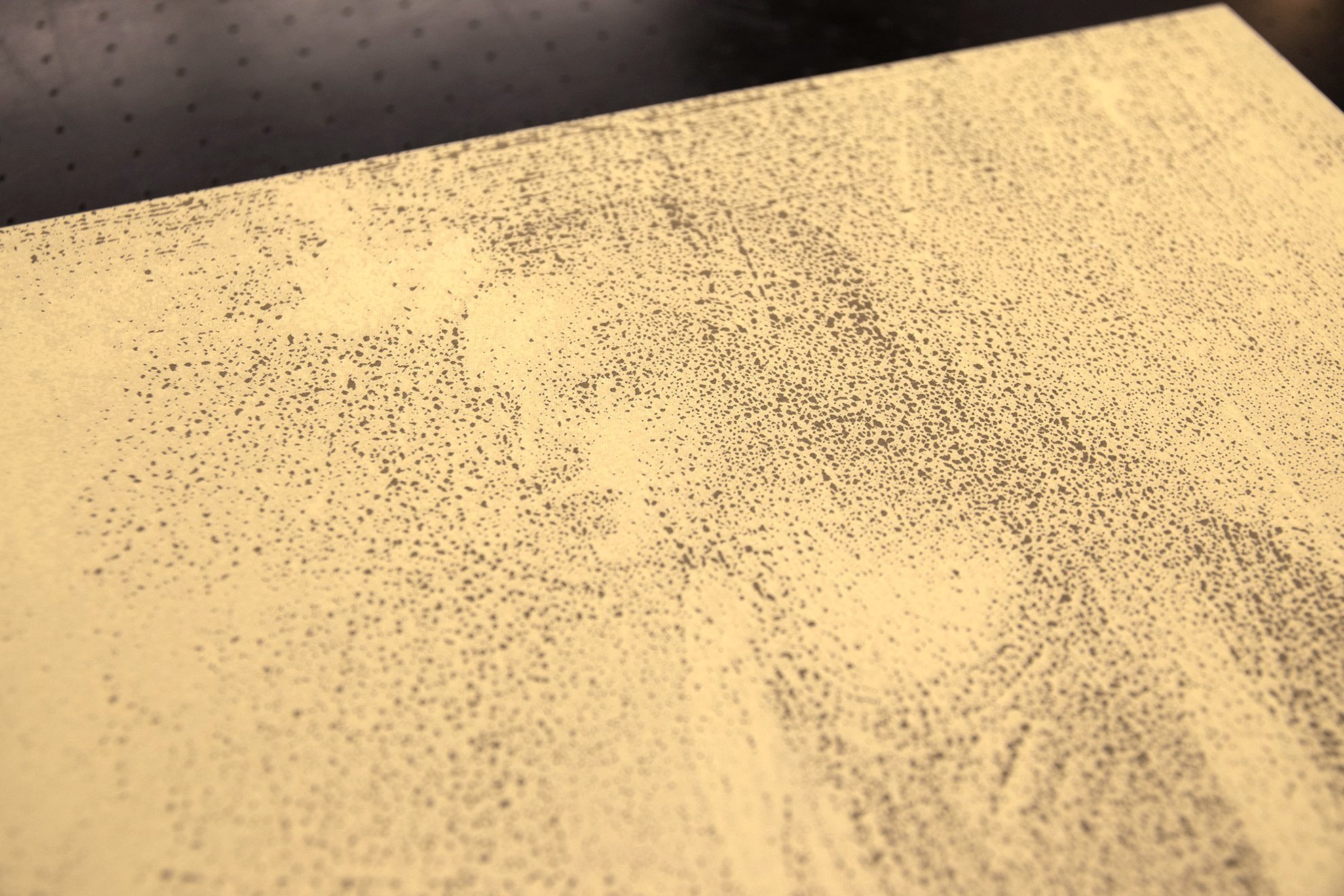 Detail of 'Reproduction' — the stippled screenprint dots forming a ghostly figure on the pale gold gesso panel surface.
