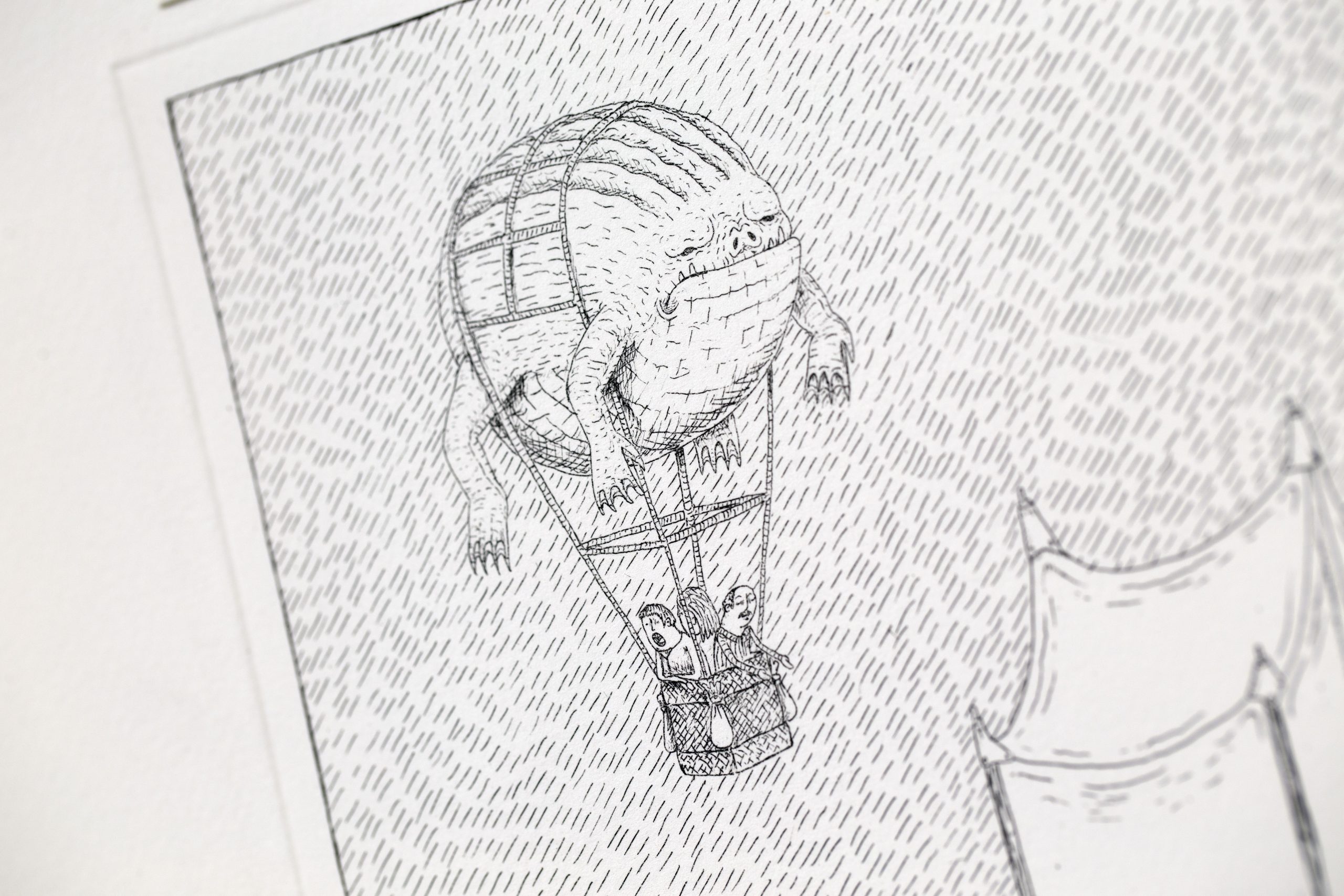 Detail of 'Migration' — a hot-air balloon formed from a strange armoured creature carrying people in its basket.