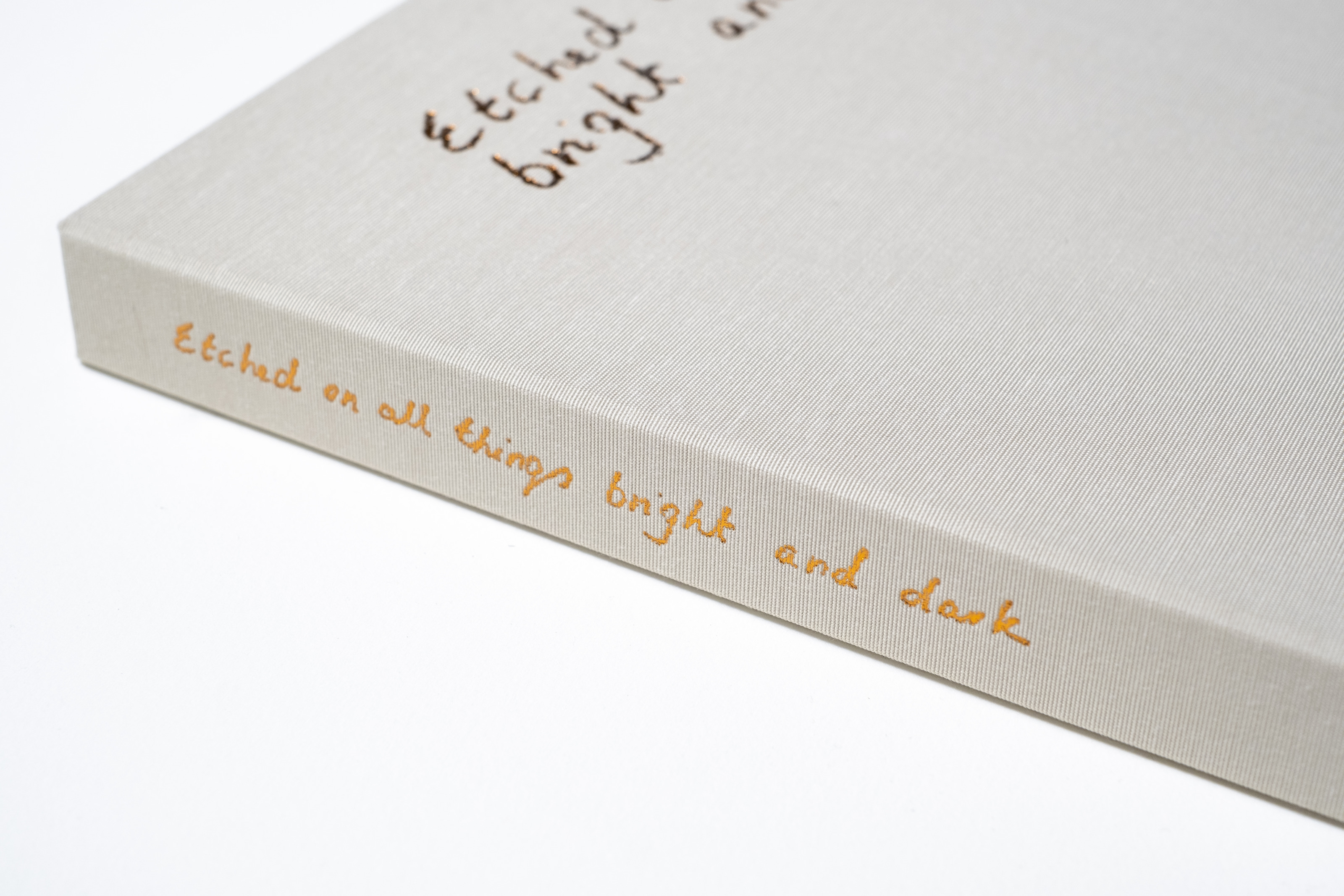Liorah Tchiprout, Etched on all things bright and dark: the box spine with its gold-foil title.