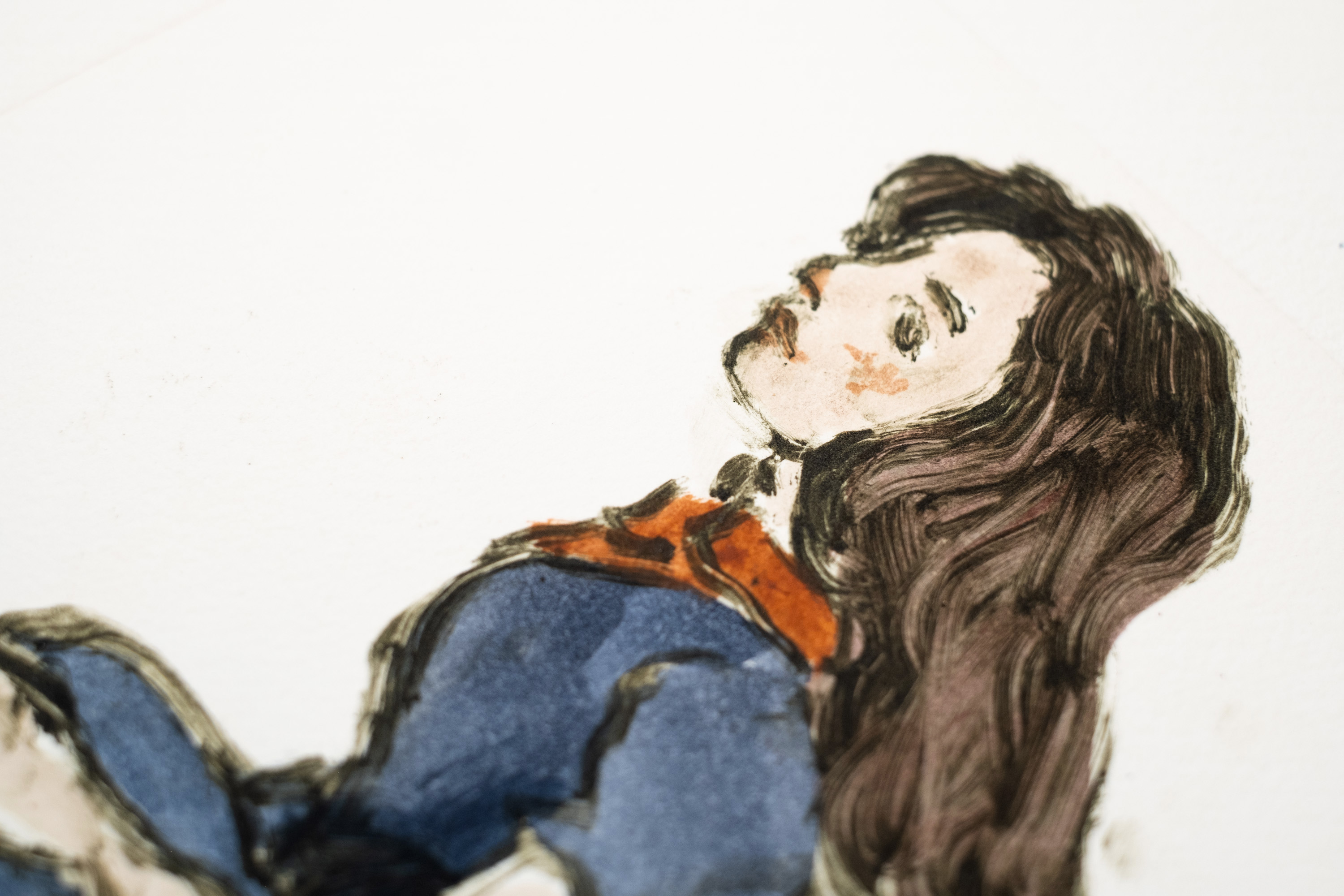 Detail of Liorah Tchiprout's Your chains are wasted on me: the woman's profile and long dark hair above an orange collar.
