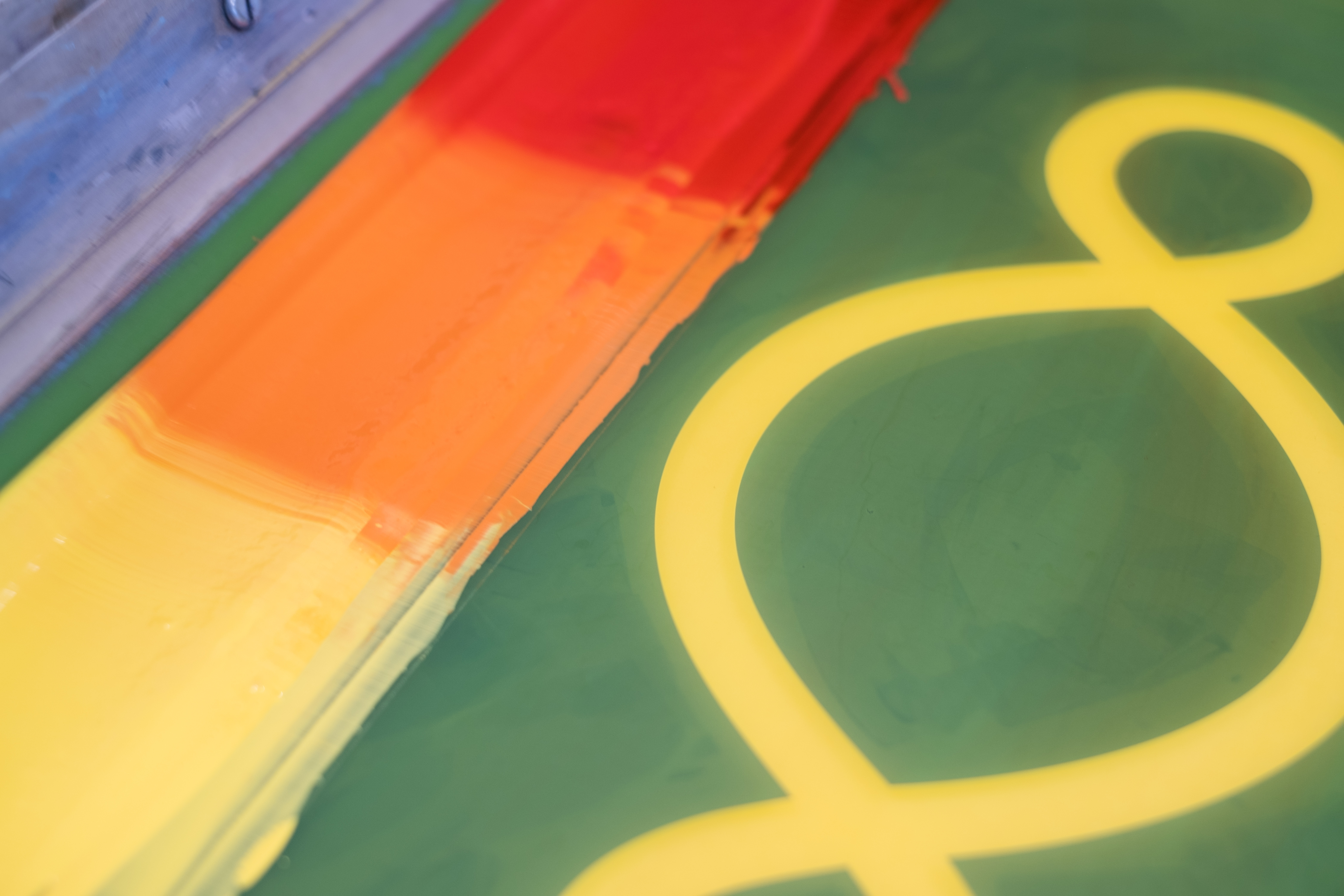 Printing Pistoletto’s Preventive Peace Flags at Atelier JI: blended yellow, orange and red ink on the screen beside the Third Paradise stencil