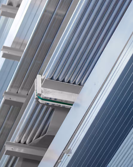 Metal tubing and extruded materials organized on warehouse storage racks