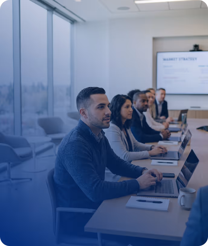 Professional team attending a business training session in a modern conference room – portage salarial audit and formation