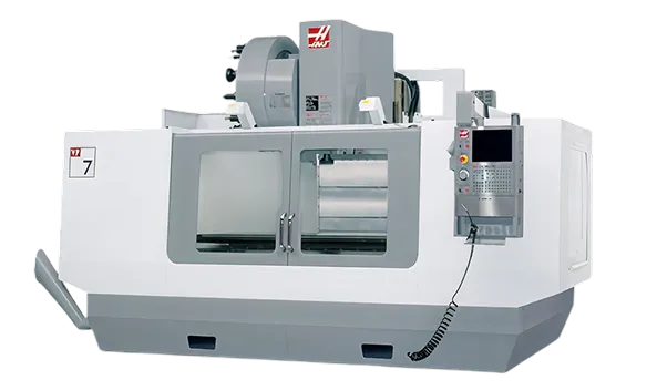Haas VF-7 vertical machining center with control panel and dual sliding doors.