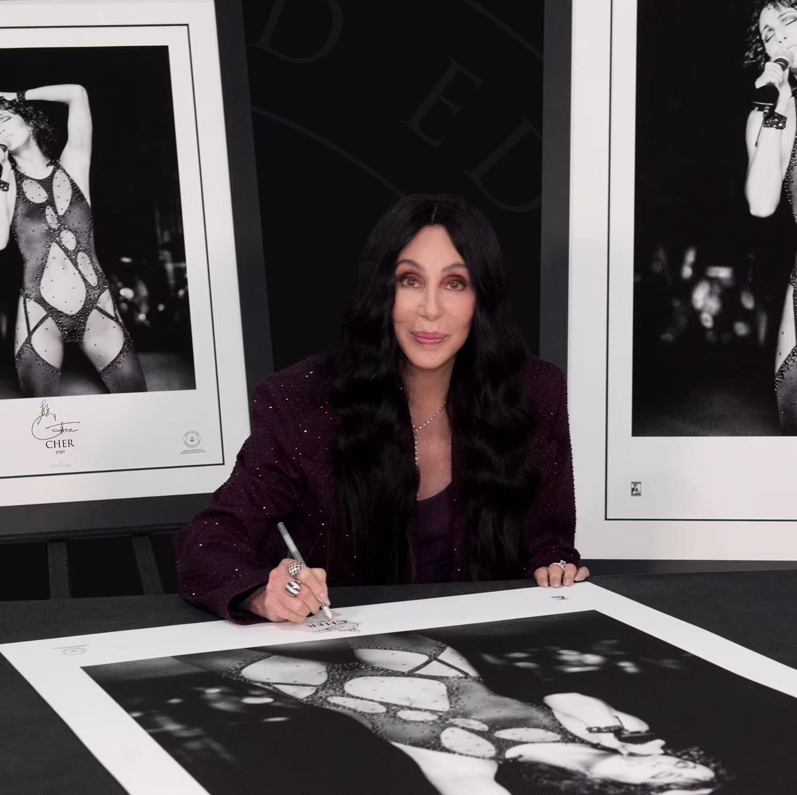 Artist signing limited edition artwork