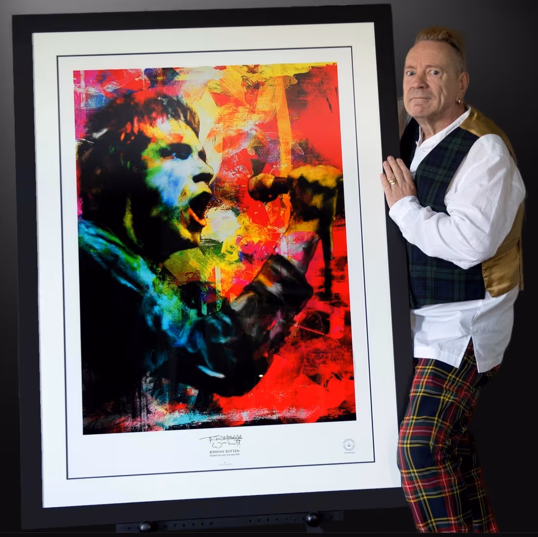 Johnny Rotten with his signed fine art limited edition colourful portrait print