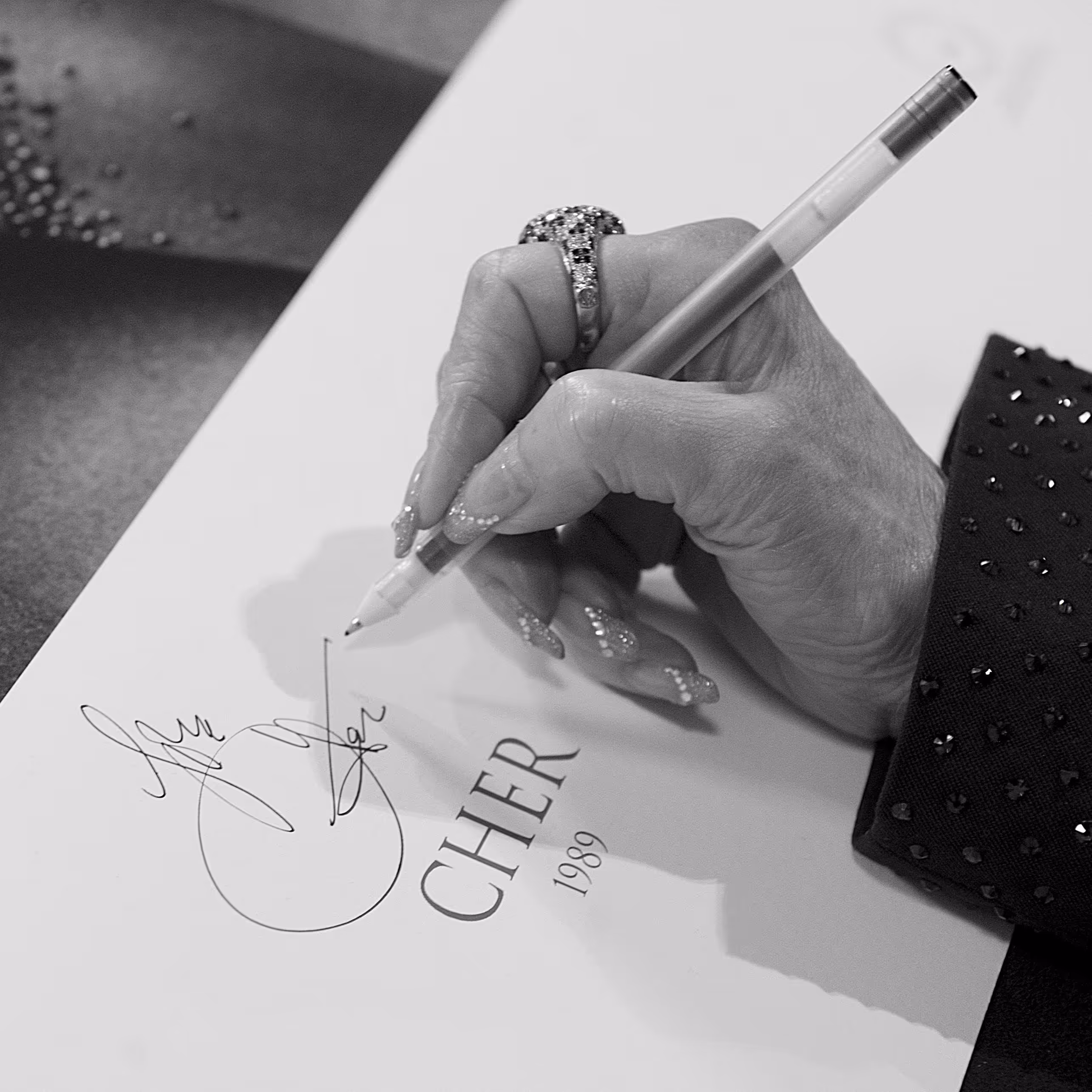 Artist signing a fine art print