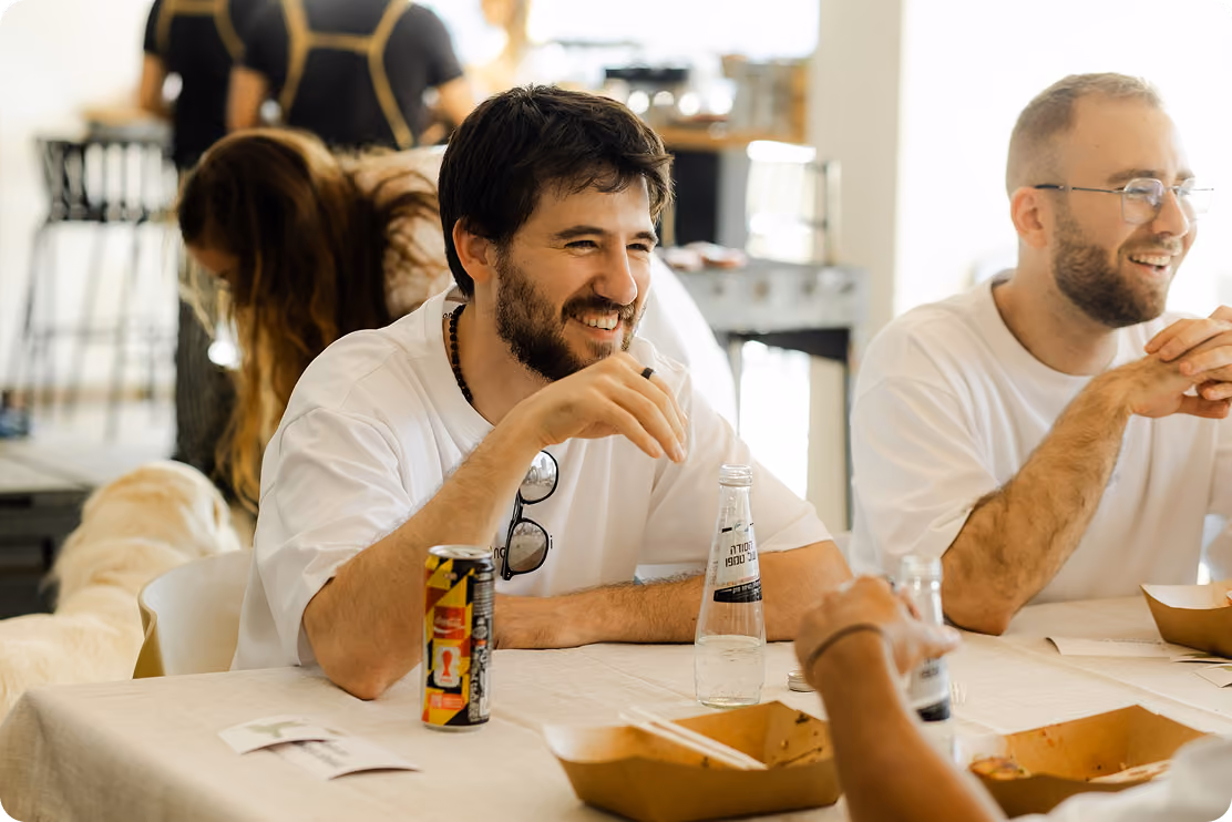 Nagomi team members talking and laughing over lunch