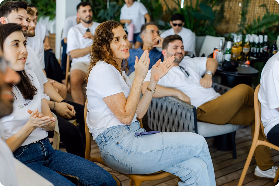 Nagomi team members laughing together at a company gathering