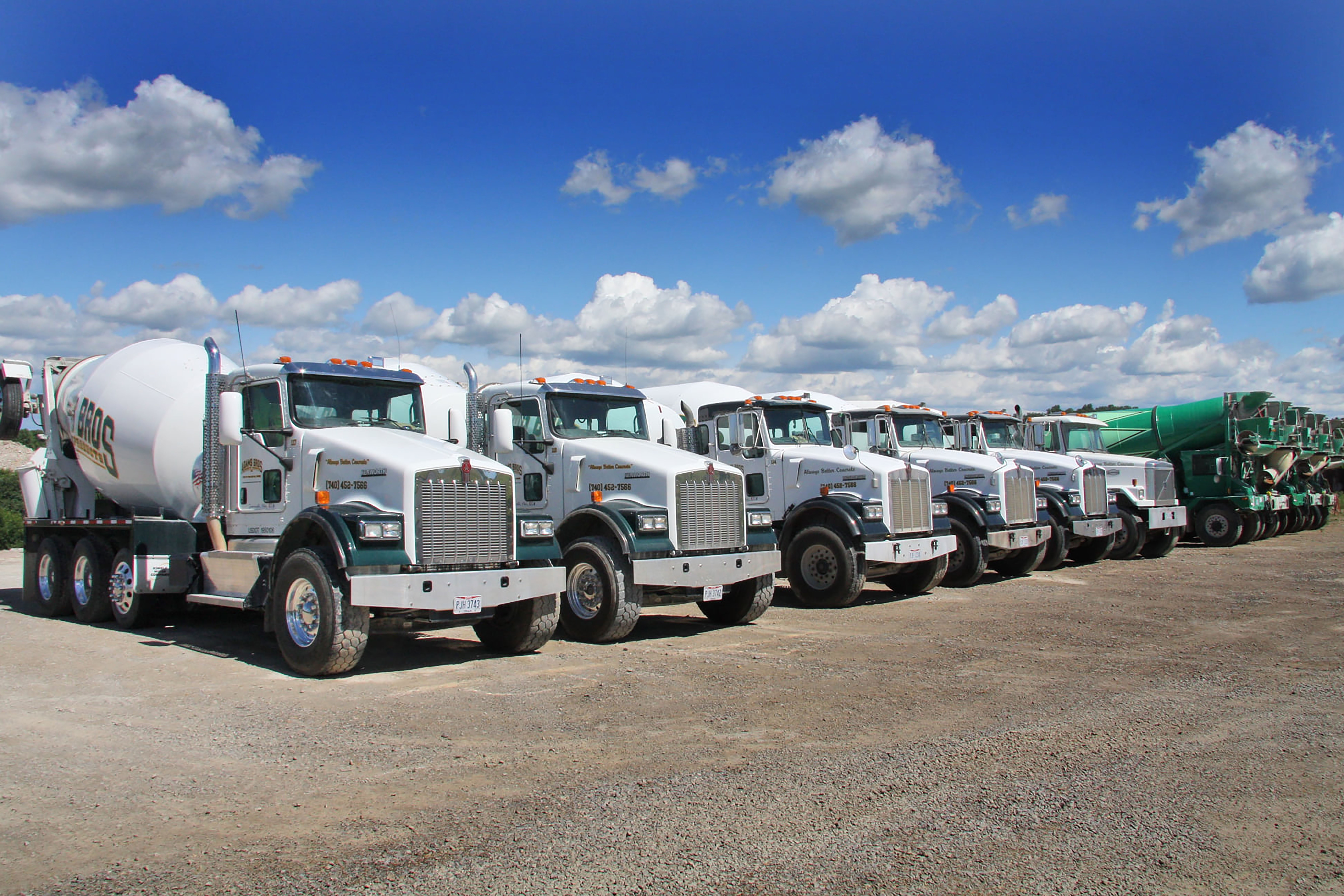 Fleet of Adams Bros Concrete ready-mix trucks lined up