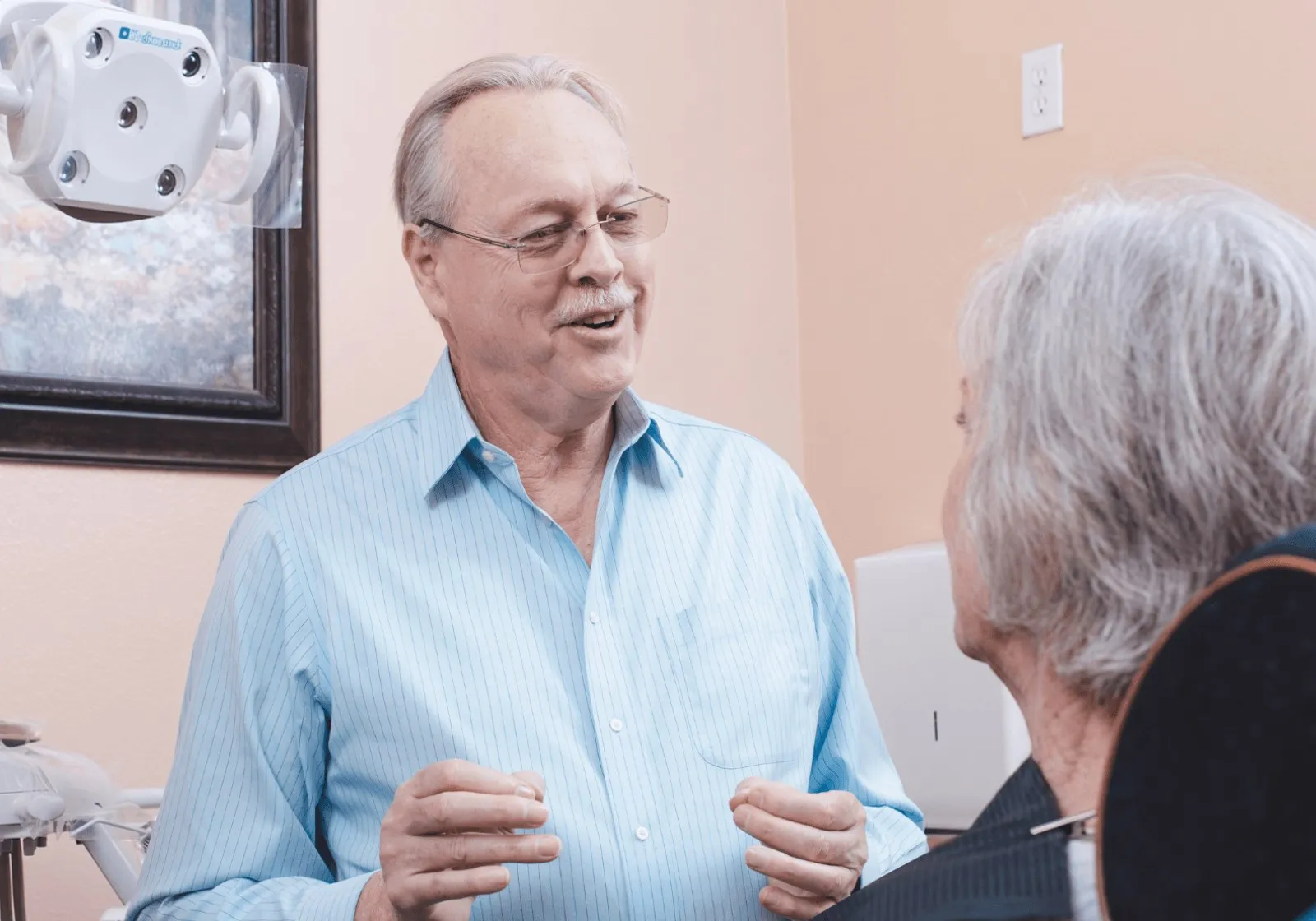 Dr. Cutts talking with a patient