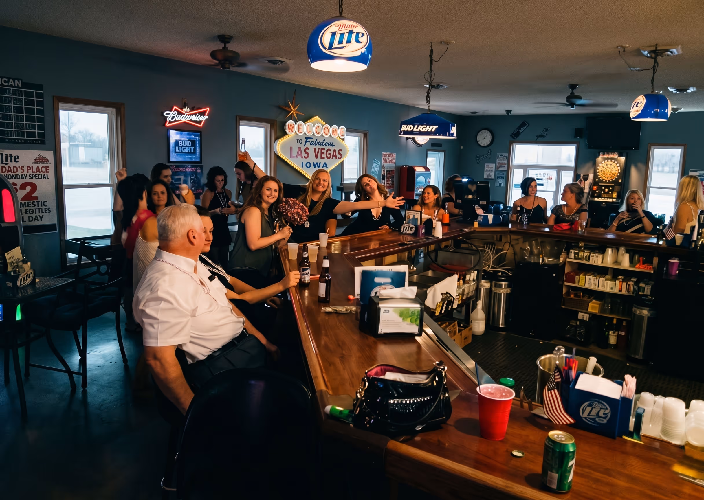 People socializing and drinking at a bar.