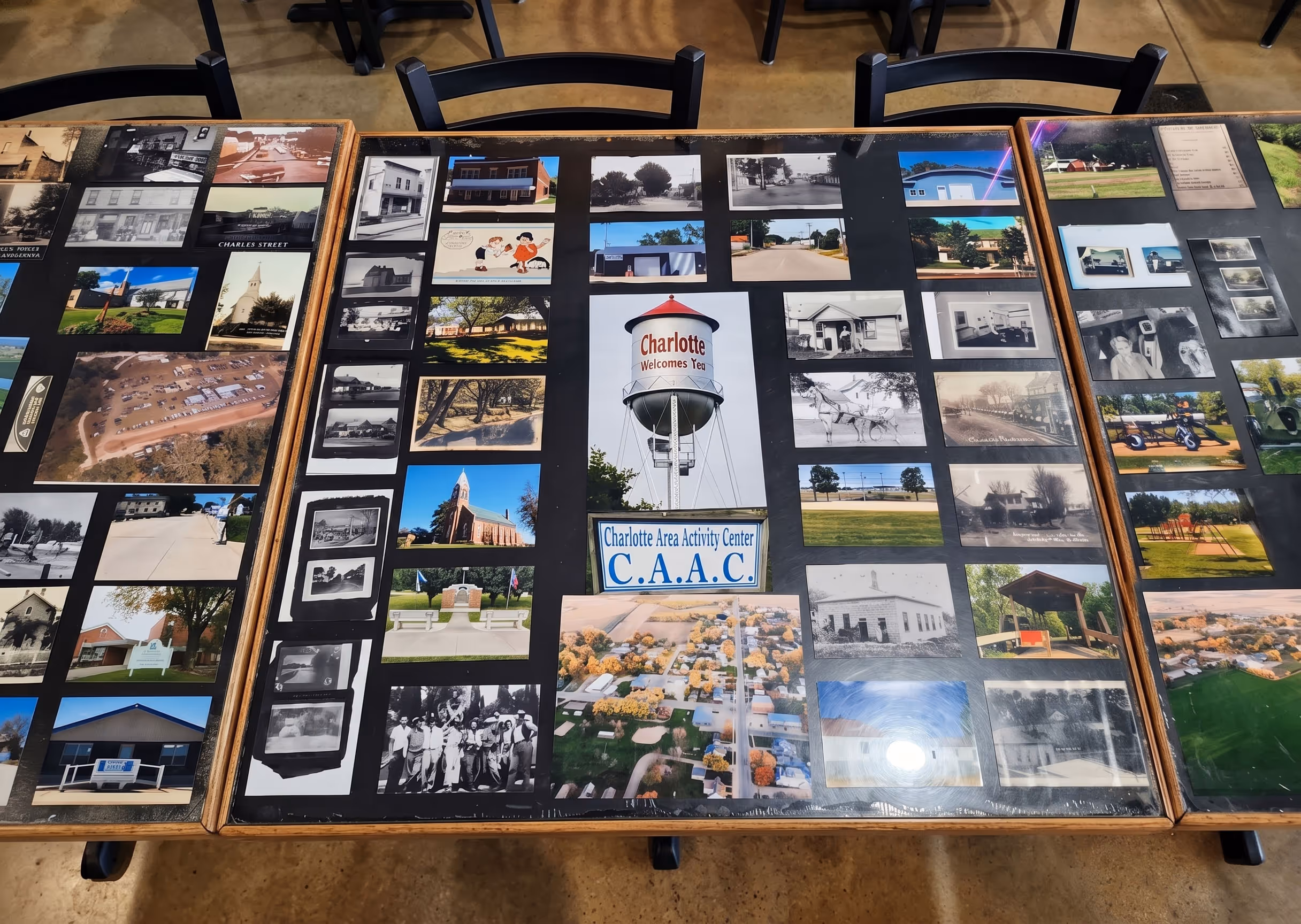 Display table with historical and modern photos.