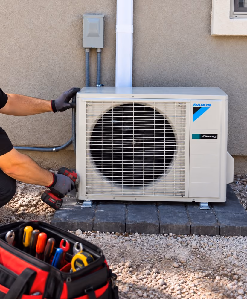 Air Duct LV technician installing a ductless mini split air conditioner.