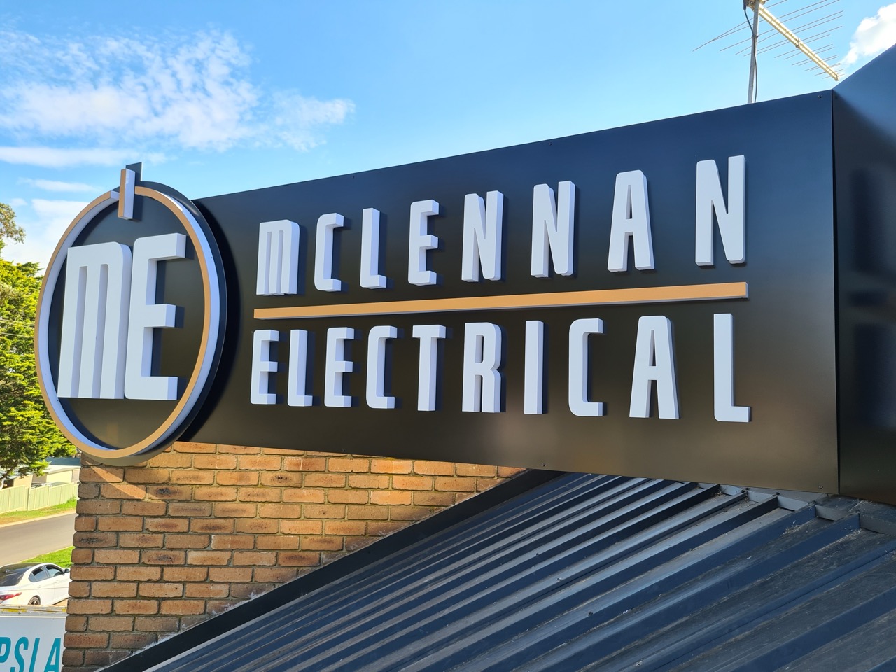 3D illuminated business signage on a black background for McLennan Electrical
