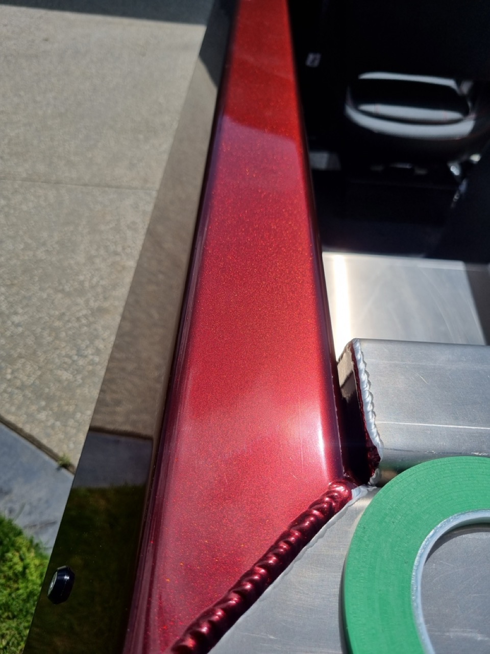 A boat wrap sign upclose in red and black by MC Grafix Sign Writing