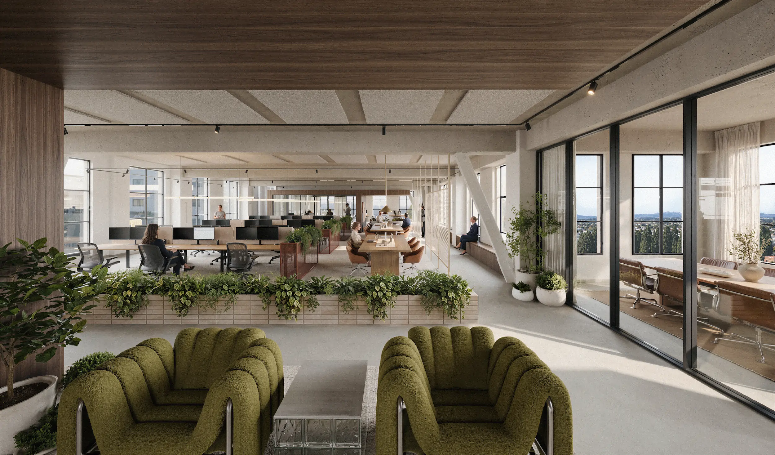 Modern open-plan office with green upholstered chairs and glass block table in the foreground, a planter with green plants dividing the space, rows of desks with computers and office chairs, and a conference room with leather chairs visible through glass walls on the right, illuminated by large windows letting in natural light.