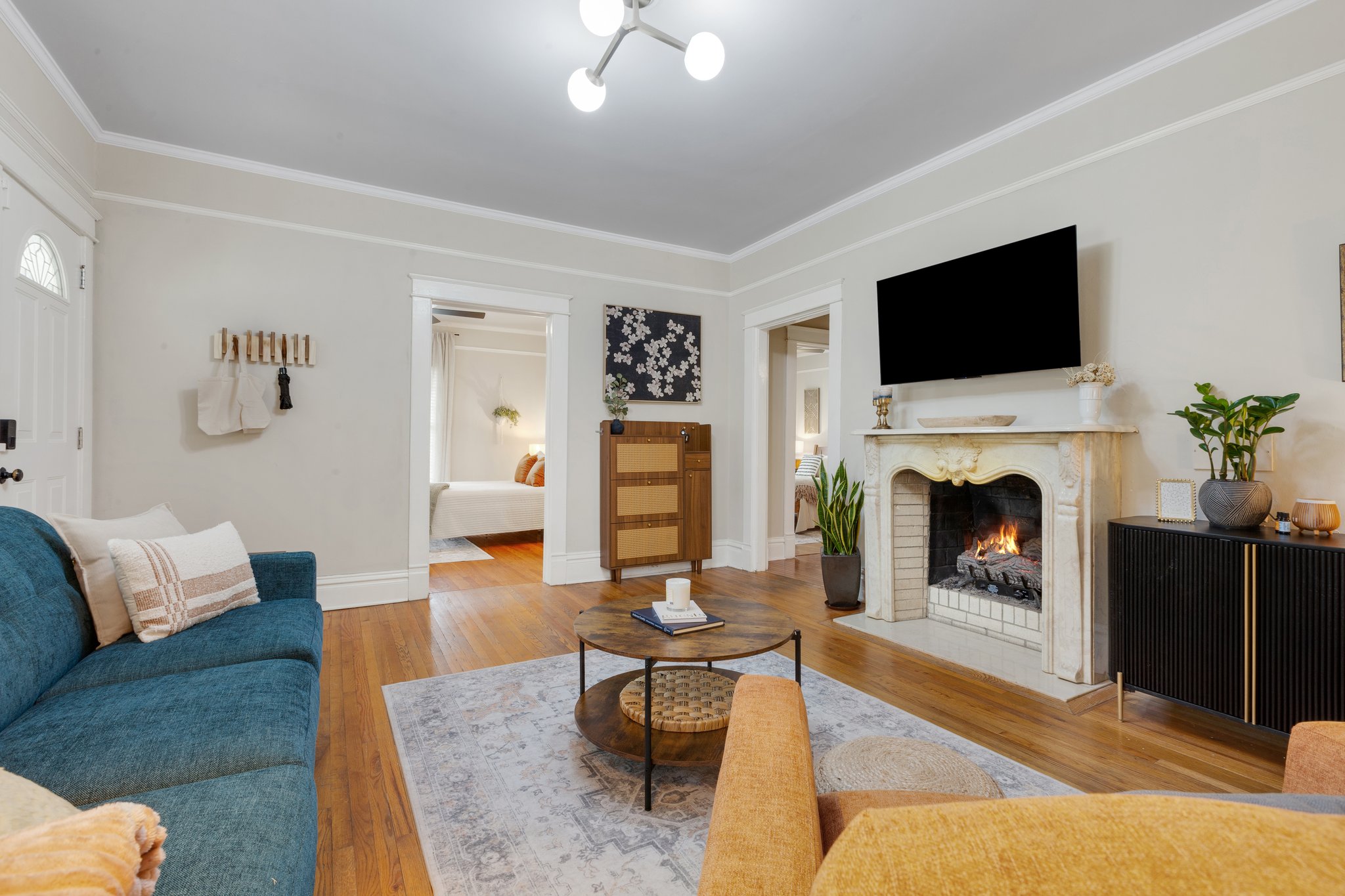 Spotless, professionally cleaned living room with lit fireplace in an Anderson, SC home by Pure Grace Cleaning Co.