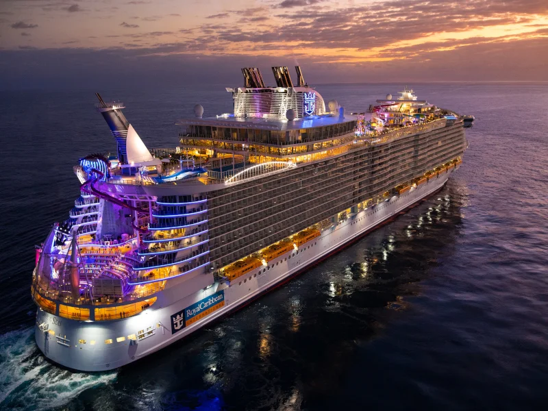 Large cruise ship in port, illustrating questions to ask before booking an accessible cabin.