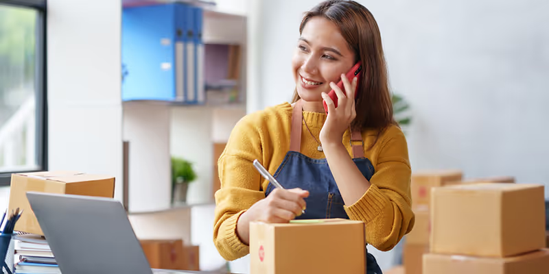 Business owner reviewing revenue-based financing options to manage cash flow and growth