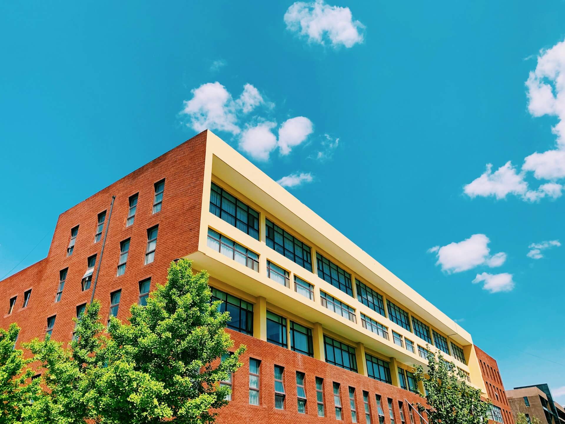 brown-concrete-building under blue sky during daytime