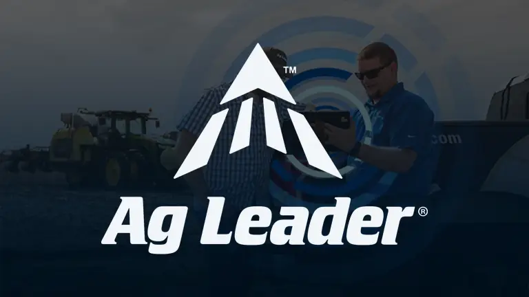 Ag Leader logo with a white stylized arrow above the words Ag Leader in bold white font, over a background featuring two men outdoors near farming equipment.