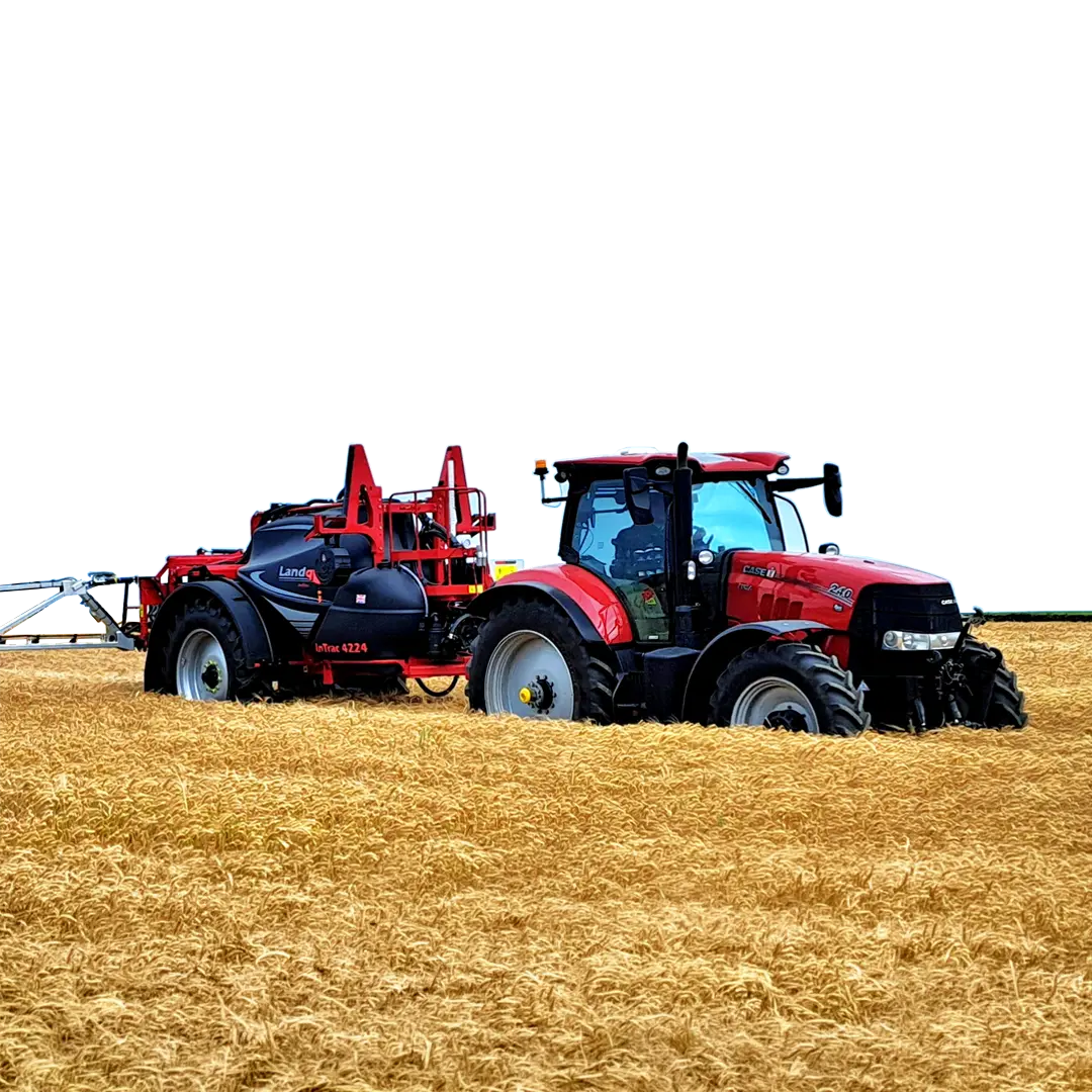 Yellow and black Landquip Vision 1500 agricultural sprayer with large tires parked on a dirt path in a field with tall crops and trees in the background.