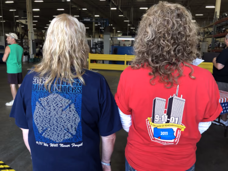 A photo graph of two women wearing 9/11 tshirts