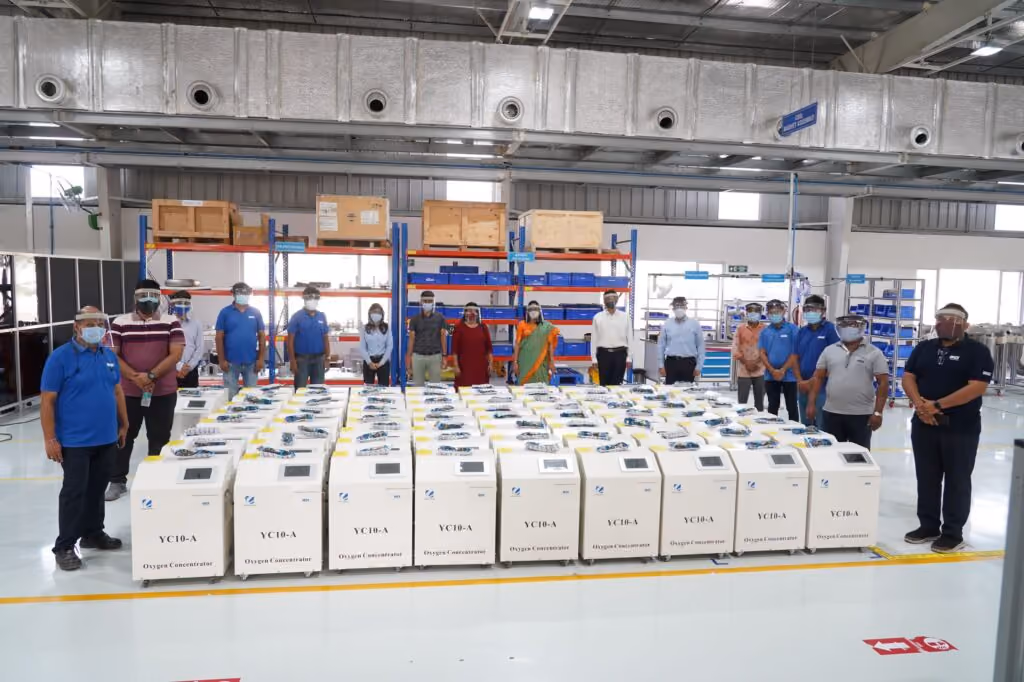 IDEX employees and pallets of Oxygen Concentrators