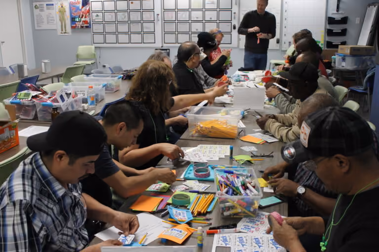 BAND-IT employees assembling the "test success kits"