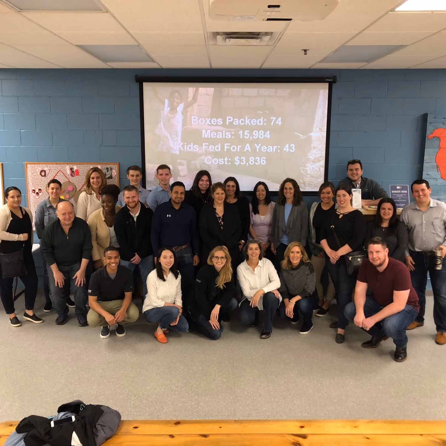 IDEX Corporate Employees Pack Food for Children in Haiti