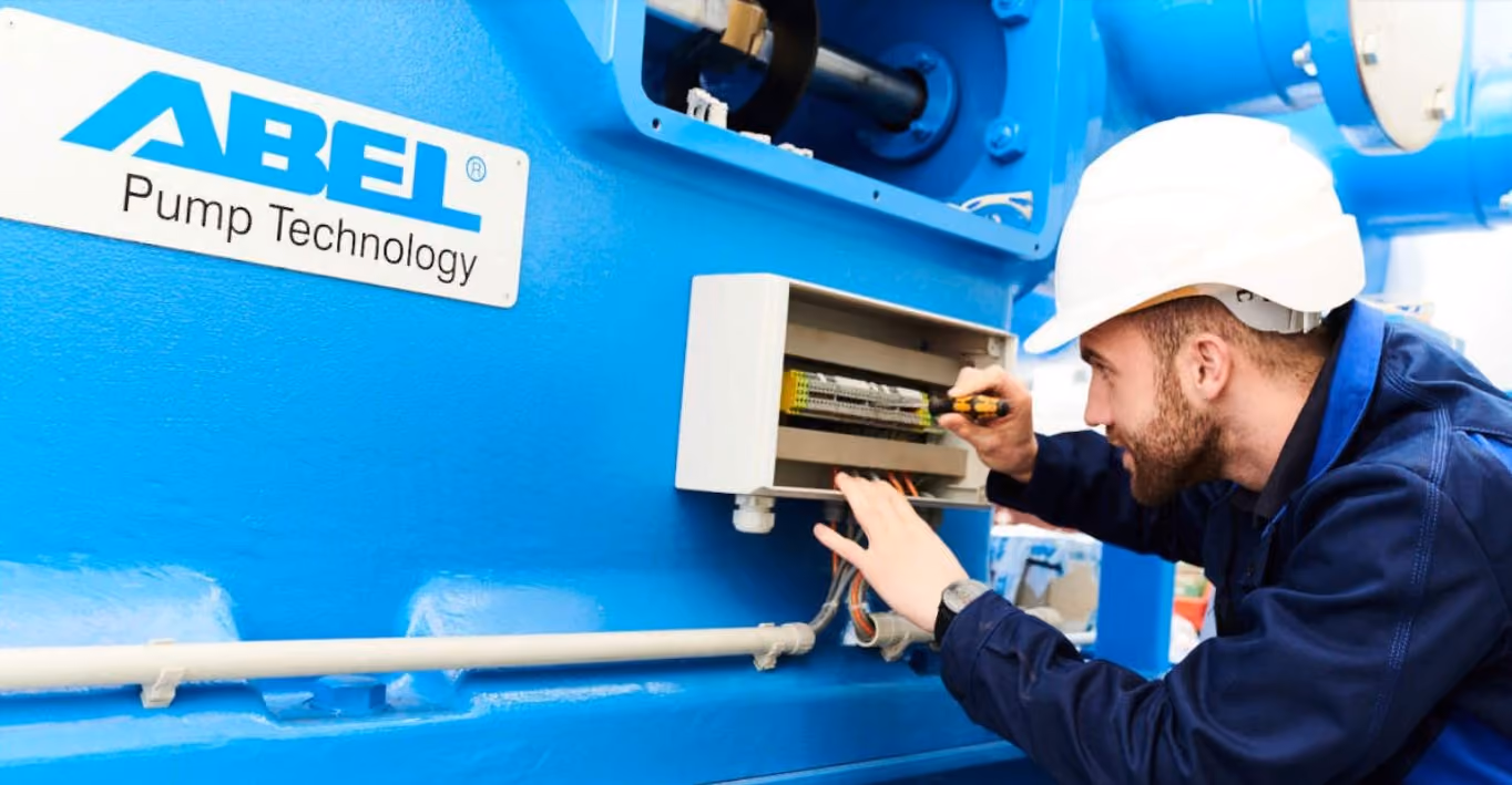A photograph of someone working on an ABEL pump