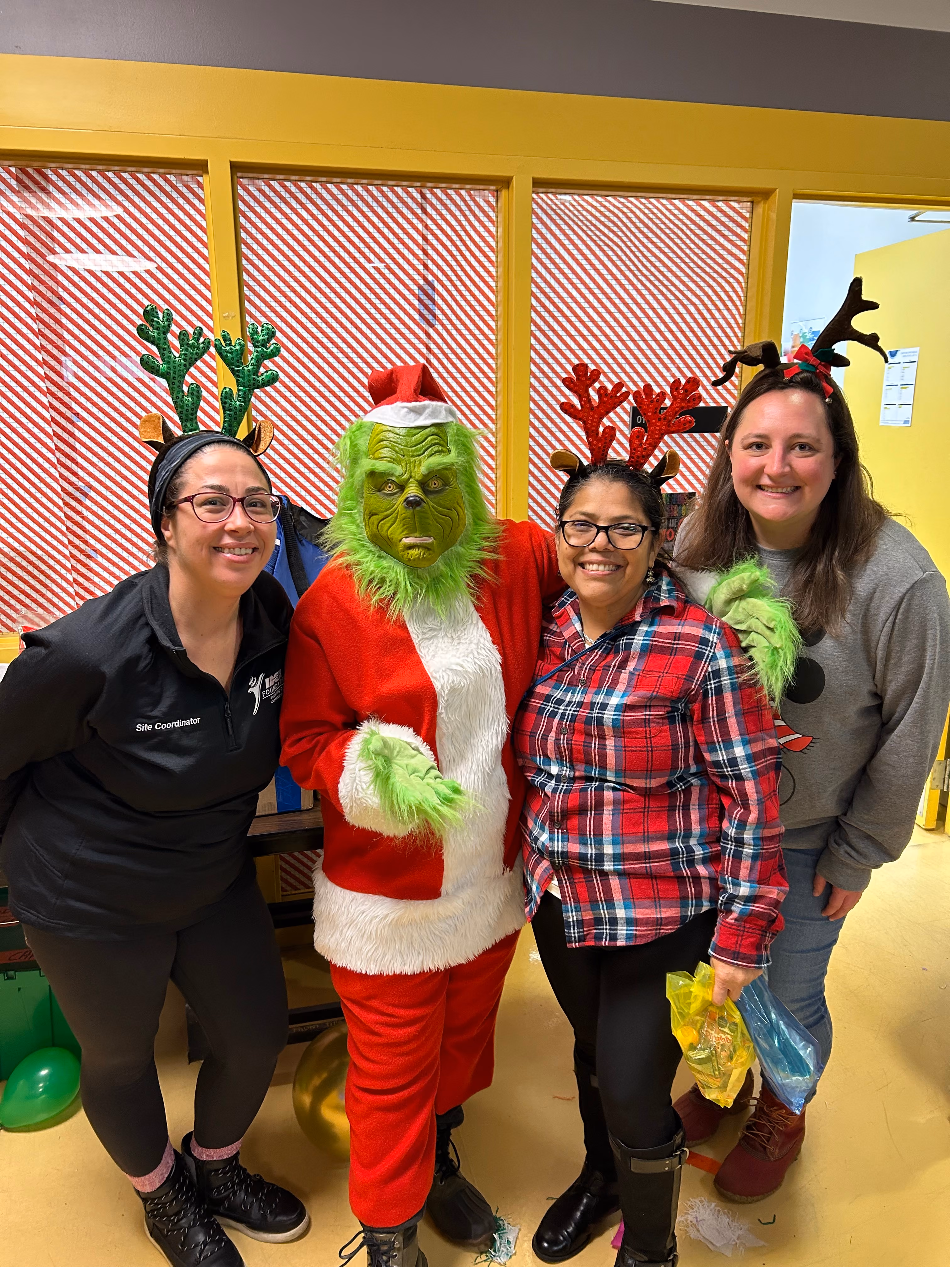 Polymer Precision Engineering employees and someone dressed as the Grinch