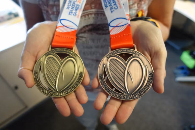 A closeup of two medals