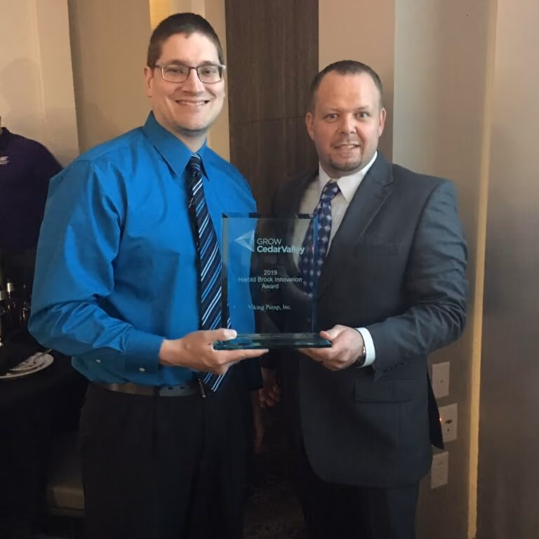 Viking Pump team members holding their Innovation Award