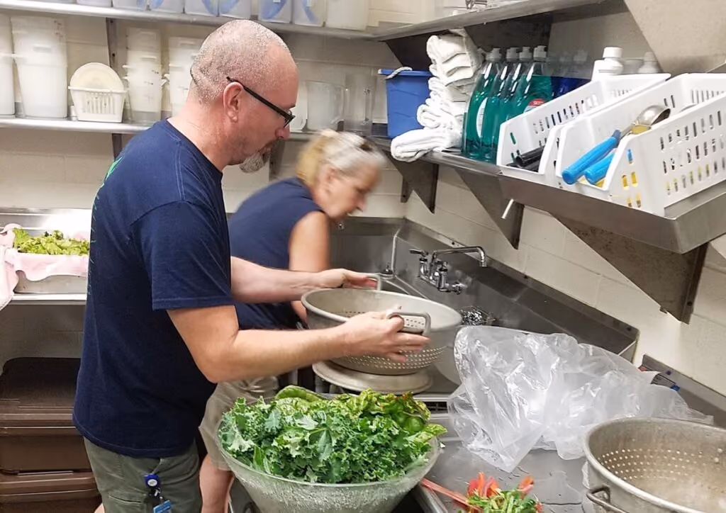 The Warren Rupp volunteers working in a kitchen