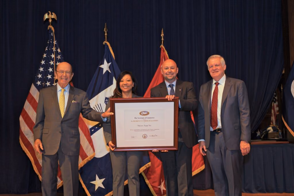 Warren Rupp team members holding their award