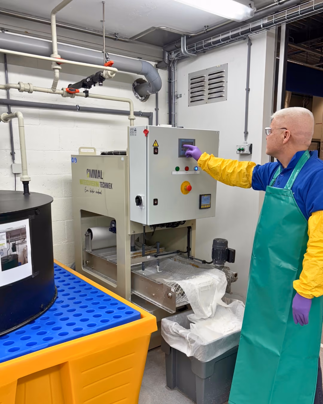 A man demonstrating the hydrofluoric acid (HF) neutralization system