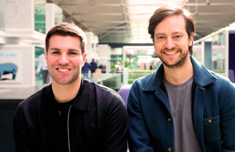 Benoit Miegeville and Aurelien Marcel sitting next to each other in a bright modern indoor space.