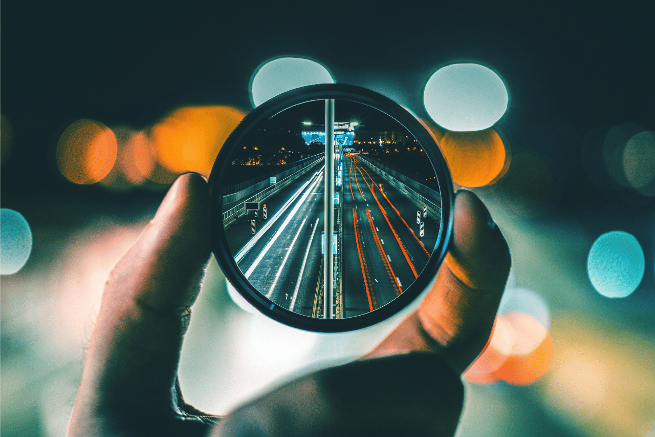 Lightstreams visible through a magnifying glass.