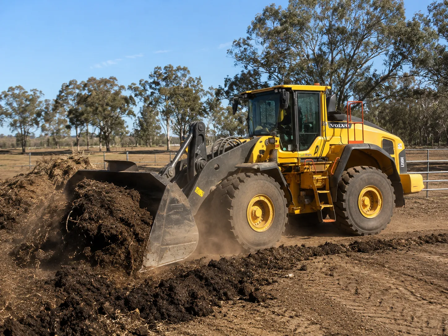 Volvo L150H loader pushing a compost windrow in Queensland.