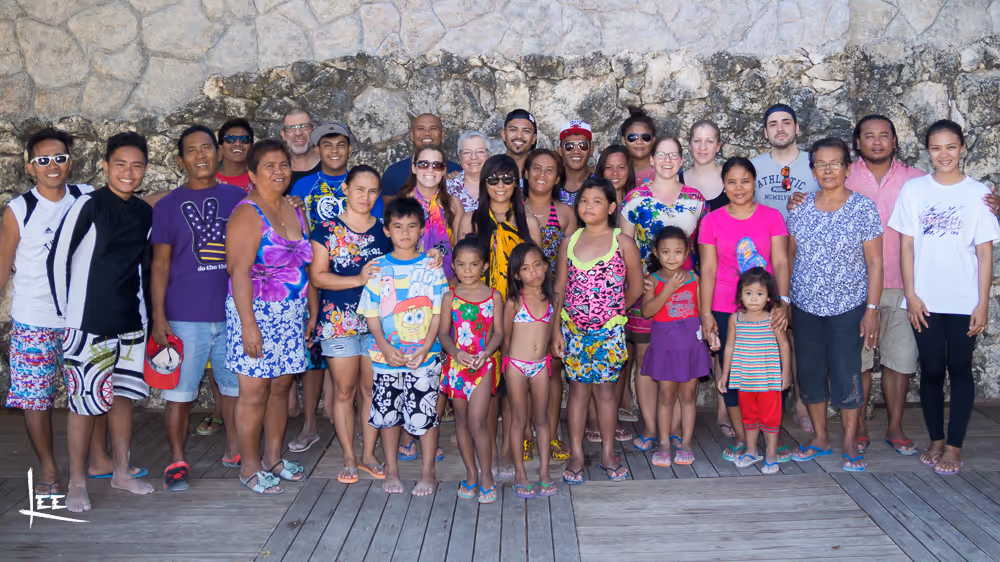 Lee Kramer with both his Swiss and Philippine families — two families, one story
