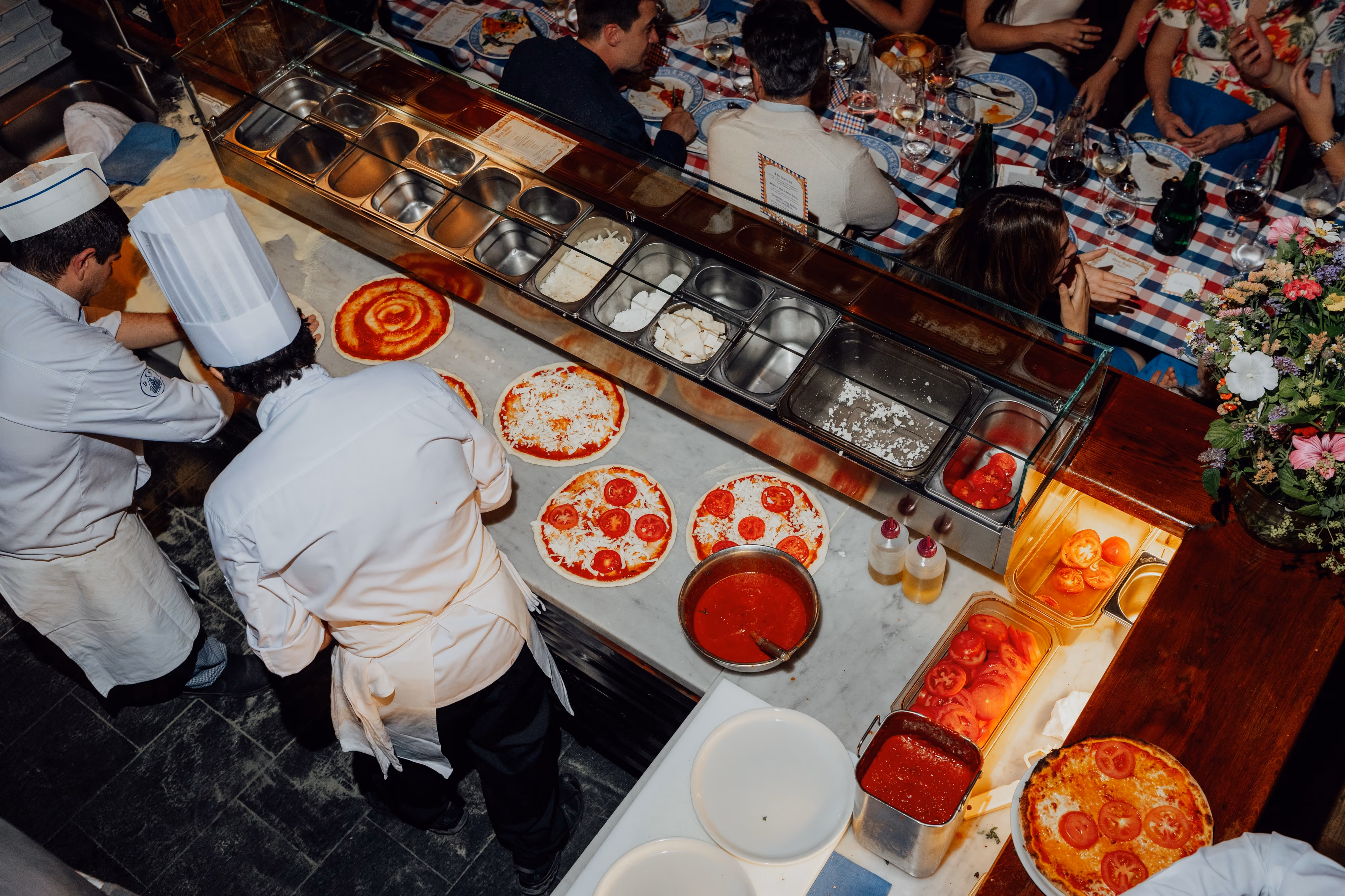 Guests gathered at Chesa Veglia, St. Moritz, for the welcome dinner — destination wedding photography by LEE by LEE KRAMER