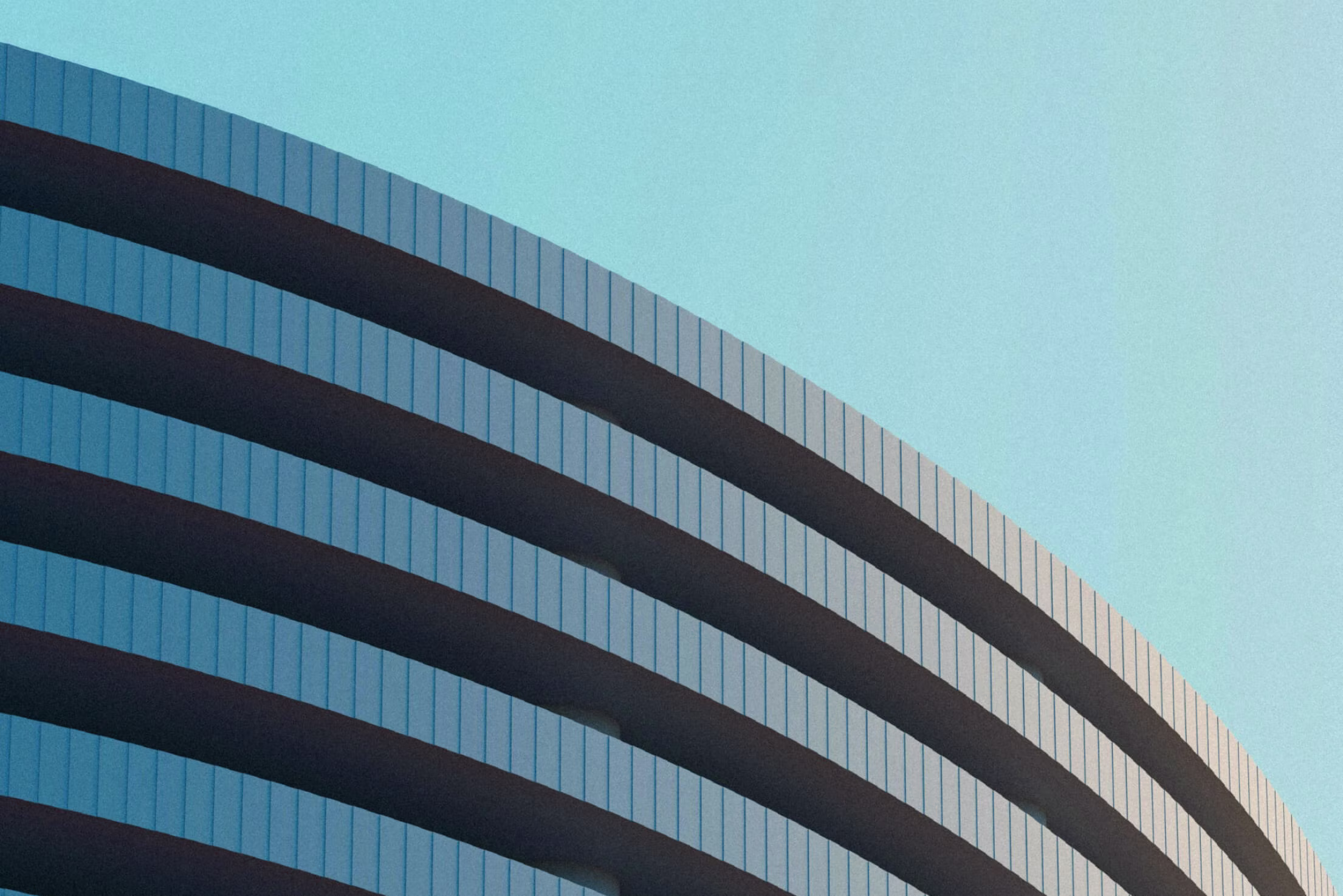 Photo of a large round building exterior.