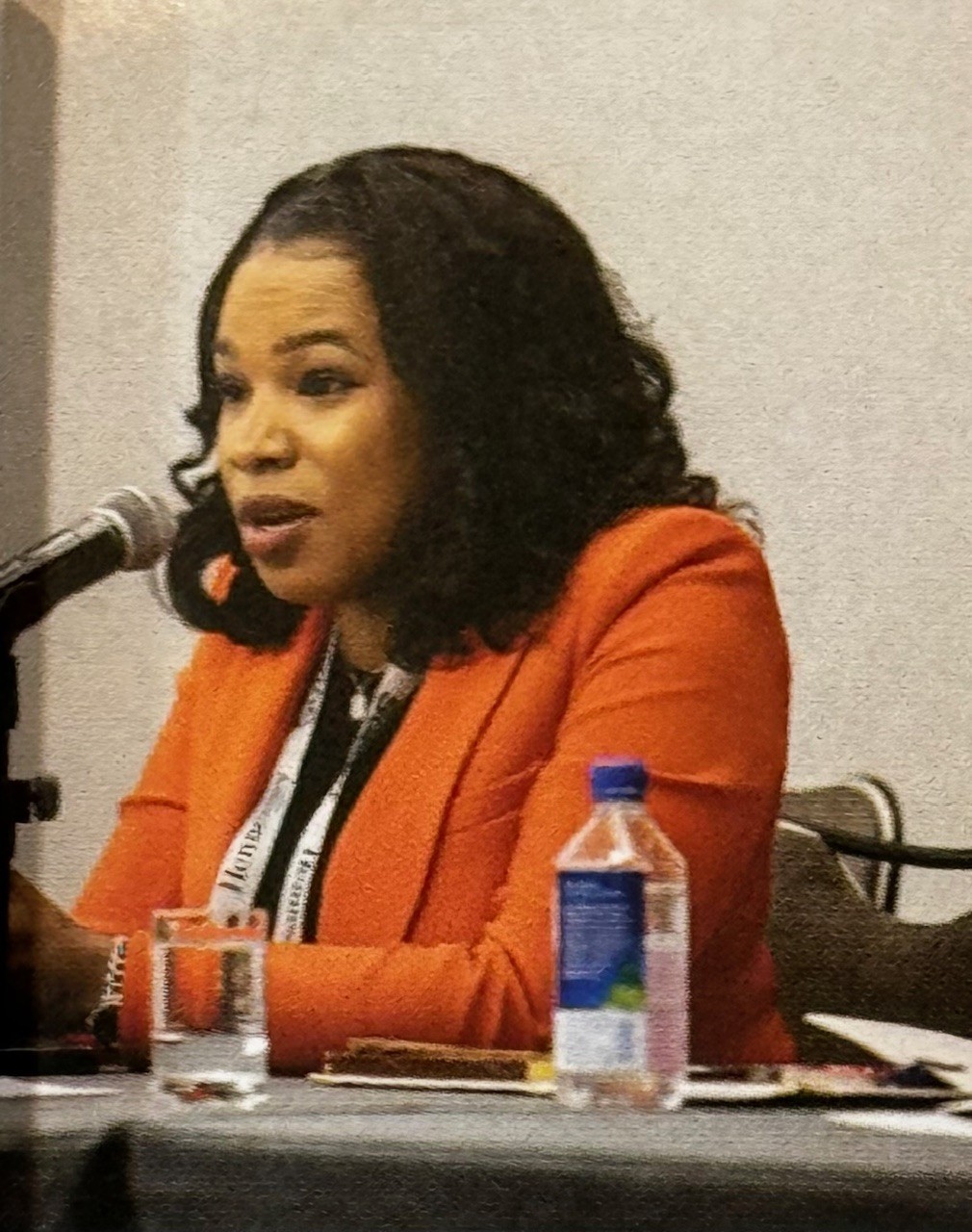 Kaysia Earley speaking at a campaign podium