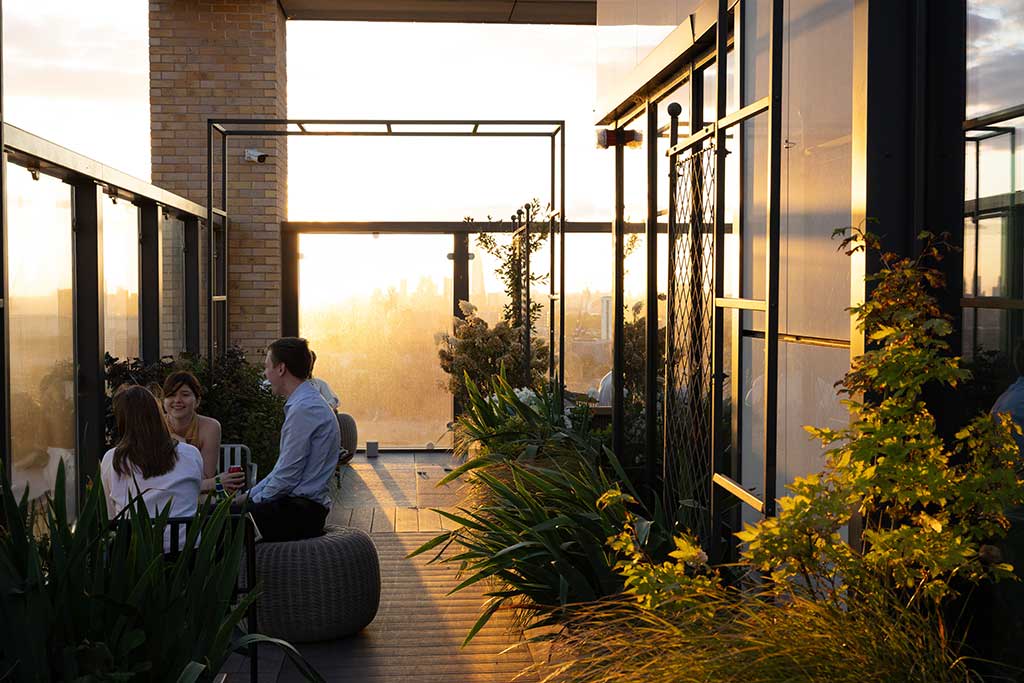 A modern apartment building in the UK features large windows and balconies that provide stunning views of the city skyline, representing a desirable option for private tenants seeking rental properties in the private rented sector. This contemporary design reflects the evolving landscape of urban living, amidst discussions around renters rights and tenancy agreements.