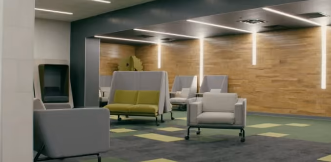 Modern office waiting area with gray and green chairs, wooden wall, and hanging linear lights.